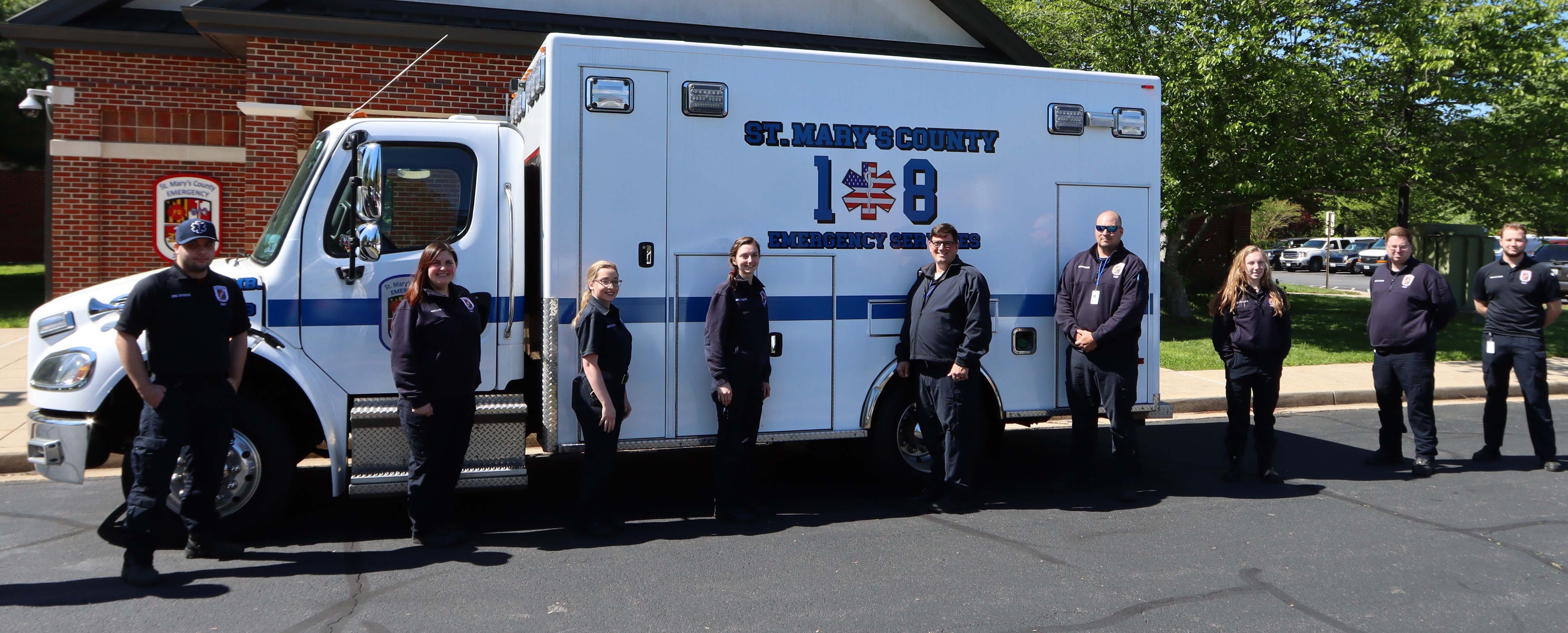 Emergency Service Members in front of ambulance